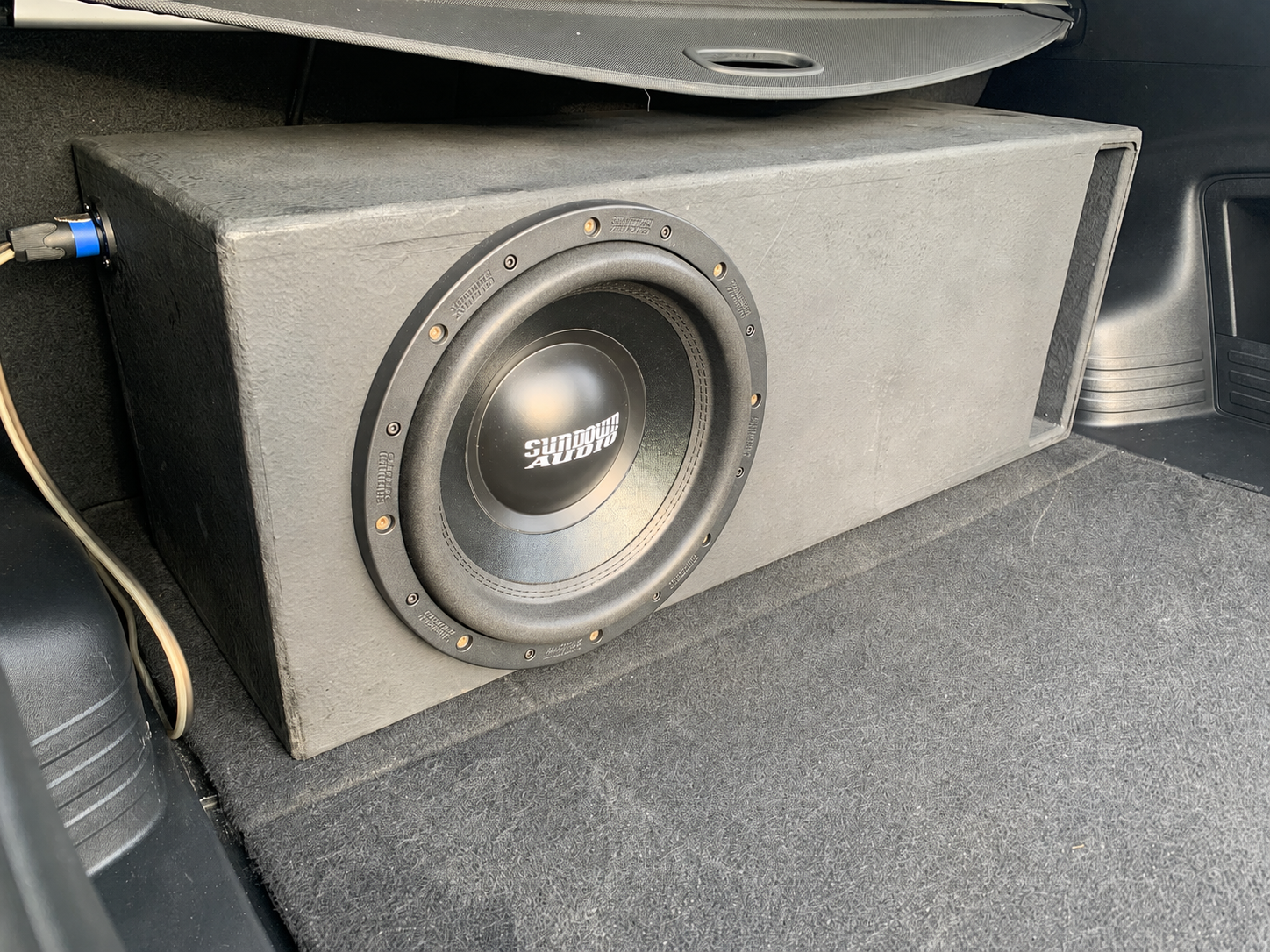 Sundown 12-inch in a carpeted ported enclosure, trunk install